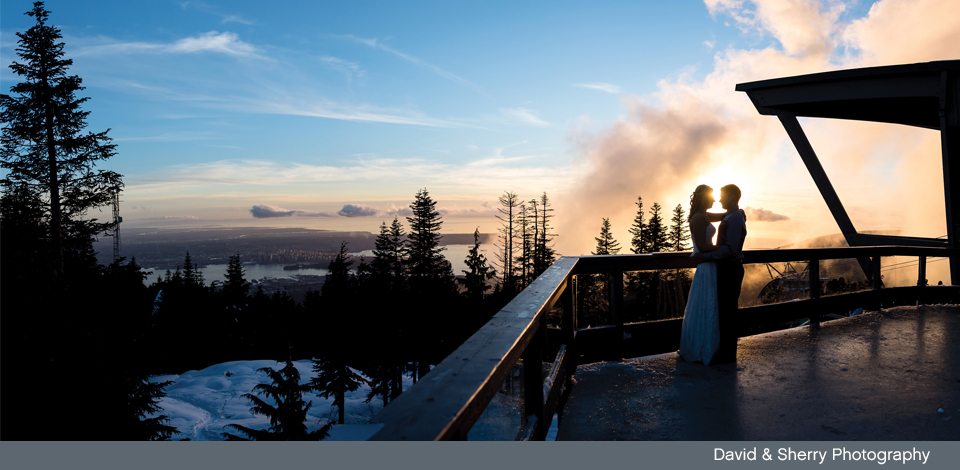 Couple on the Timber Deck sunset looking onto Vancouver skyline